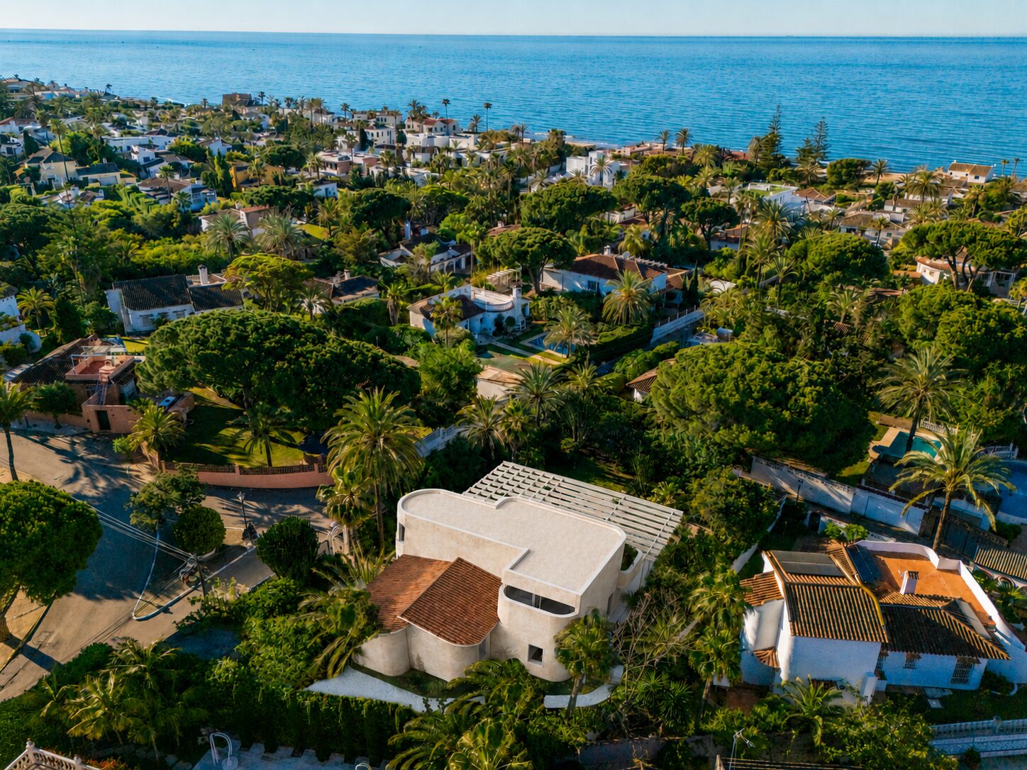 Aerial view of Can Cayú with the Mediterranean beyond